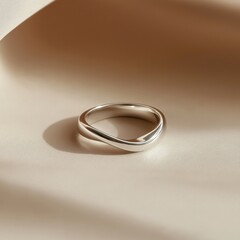 Golden silver wedding rings on a beige background symbolizing love and marriage
