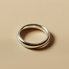 Golden silver wedding rings on a beige background symbolizing love and marriage