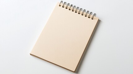 Work office. Blank spiral notepad on a light background, ideal for notes and sketches.
