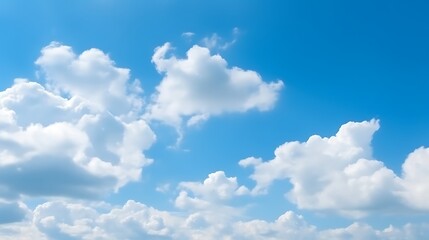 White puffy clouds drift across a vibrant blue sky