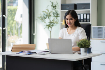 Professional businesswoman analyzing stats and graphs on paperwork outside a modern office building. Ideal for themes of success, analysis, and corporate growth.