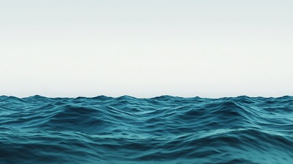 Serene ocean waves under a pale sky.