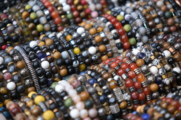 many colorful bracelets craft background