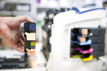 Technician Holding ink printer toner low for replace new or fix repair problem paper or print...