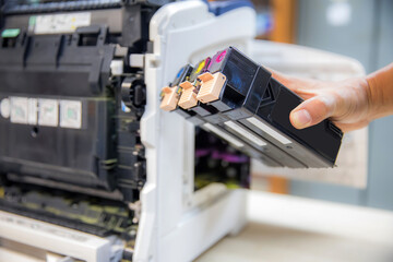 Technician Holding ink printer toner low for replace new or fix repair problem paper or print...