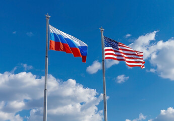 US and Russian Flags Flying Side by Side Against Clear Blue Sky