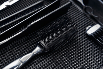 Professional hair styling tools organized on a work surface in a salon