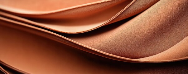 Velvet abstract background idea. Beautifully folded satin fabric with smooth contours and warm tones.