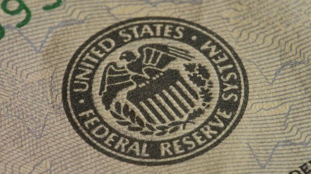 United States Federal Reserve seal close up of US Dollar note. United States financial system concept.