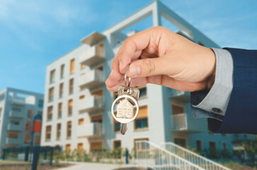 Real estate agent giving the keys