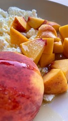 A summer dessert of sliced peaches garnished with sugar. Taste and freshness of the summer harvest.