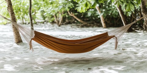 Relaxing hammock under tropical trees on sandy beach
