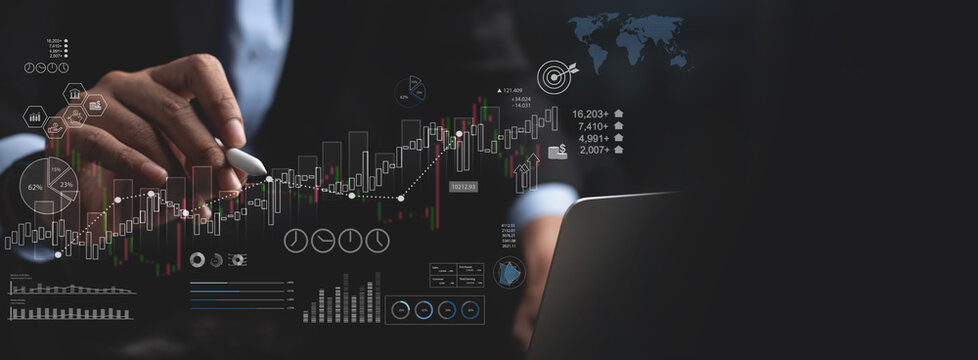 Business, finance and investment concept. Finance analyst using digital tablet touching on business growth graph chart on virtual screen, asset management, data analysis, business target and plan