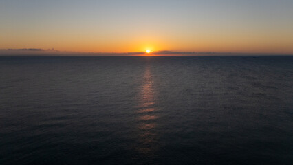 Drone aerial view of sea during sunrise