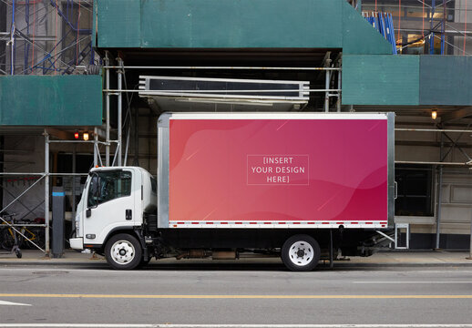 White Delivery Truck Parked in Front of Construction Site in New York