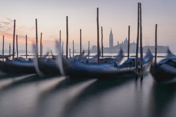 Venice at Dawn: Reflective Gondolas in a Misty Lagoon