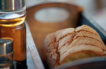 Restaurant set on table - oil, vinegar, bread, close-up. Shallow depth of field