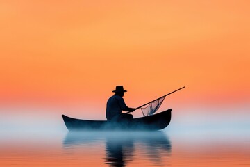 Obraz premium Silhouette of a fisherman in a boat at sunset over calm waters.