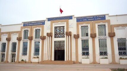 Chamber of Commerce, Industry and Services, Agadir
on the signs is written: Chamber of Commerce, Industry and Services Souss Massa
on the left in French
in the middle in Arabic
on the right in Amazigh