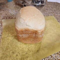 Homemade Bread Machine Loaf on Parchment Paper - Perfectly Baked and Fluffy