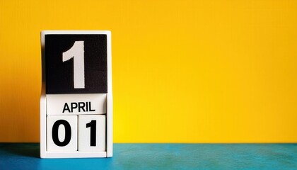 April 1st Minimalistic Wooden Calendar on Vibrant Yellow and Blue Background for Fool's Day Celebrations, Perfect for Creative Pranks, Social Media Campaigns, and Fun Holiday Reminders