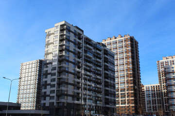Naklejka premium modern new buildings, apartment buildings and offices in the city, skyscrapers