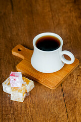 Enjoying coffee and traditional sweets on a wooden table