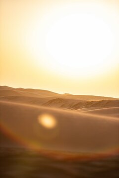Khongor Sand Dunes in the Gobi Desert of Mongolia. Vast golden sand dunes stretching across the desert landscape, surrounded by mountains and showcasing the unique beauty of one of Mongolia&rsquo;s most ico
