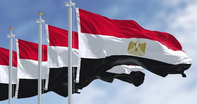 National flags of Egypt waving in the wind on a clear day