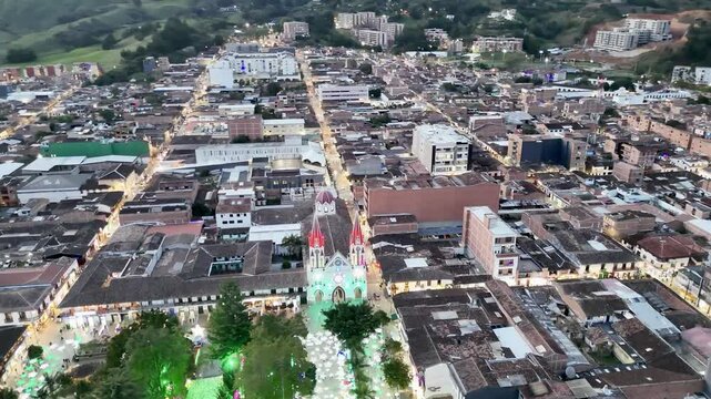 Aereal view of the town of La Ceja del Tambo, and at the center the Bas&iacute;lica Menor de Nuestra Se&ntilde;ora del Carmen during Christmas