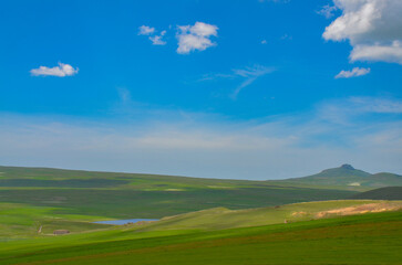 Miro Lake, Mount Harsnakar and alpine valley between Mount Aragats and  Pambak Mountain range scenic view from Spitak pass (Tsilkar, Armenia) 