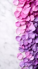 Obraz premium Pink and purple rose petals scattered on a marble background. A beautiful and delicate image, perfect for adding a touch of elegance to your projects.