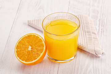 Sweet fresh orange juice in the glass