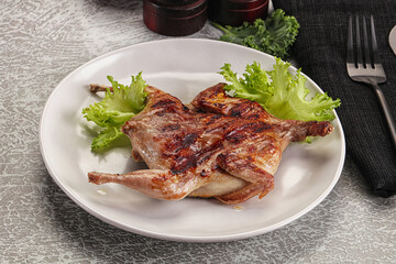 Grilled quail in the plate