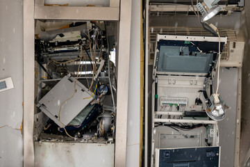 Disassembled electronic equipment inside a maintenance area showcasing intricate components and wiring details