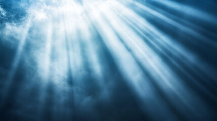 Sunlight streams through clouds creating a serene atmosphere over water