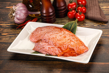 Raw marinated duck breast for cooking