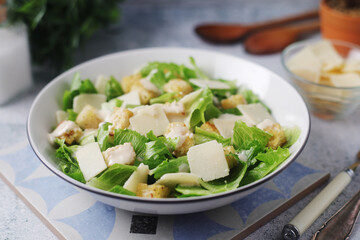A bowl with classic Caesar salad