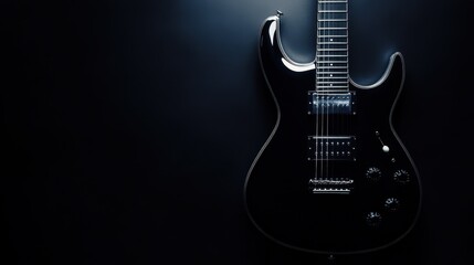 Fototapeta premium An electric guitar standing upright, its shiny body reflecting light against a dark black background.