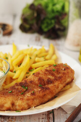 Fish and chips served on the plate, traditional dish of Great Britain