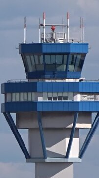 close-up aerial shot right side airport control tower focuses structural design elements that make control tower critical component airport's aerial view close-up architecture aviation