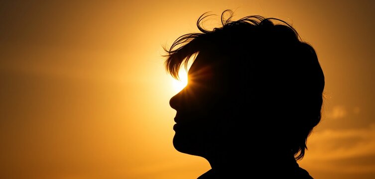 silhouette of a person in the sun