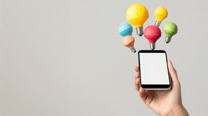 Hand holding a smartphone with colorful light bulbs floating above, creativity and innovation in technology, mobile app inspiration and startup concept.
