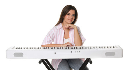 Beautiful woman posing with synthesizer on white background