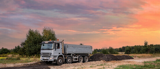 Dump or truck at a construction site in a quarry. Powerful modern equipment for earthworks....