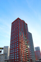 Fototapeta premium modern office building, red facade of a new building, skyscrapers in the city of Kyiv, Ukraine,