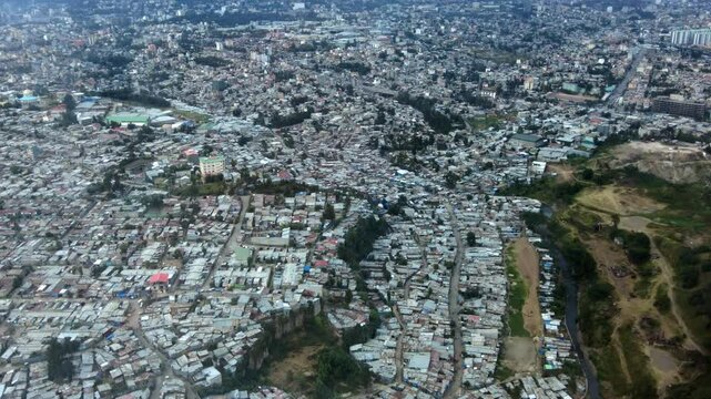 Aerial flyover of the large city of Addis Ababa, Ethiopia, taken from an airplane.