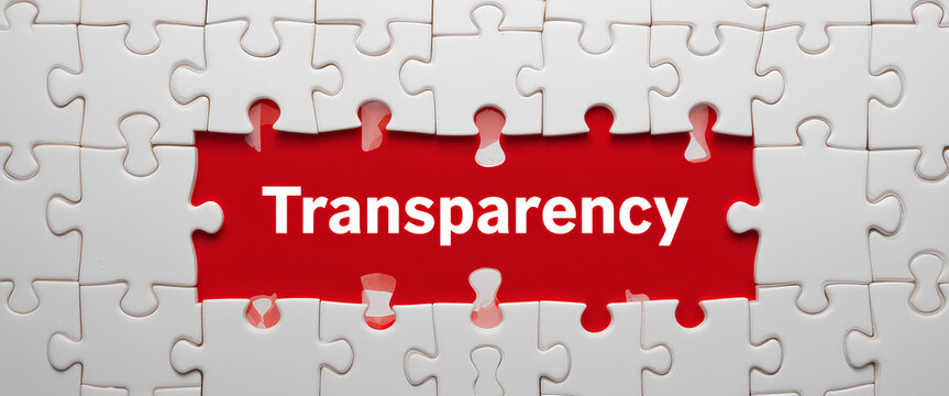 white puzzle with missing piece, revealing red background with the word 'transparency'.