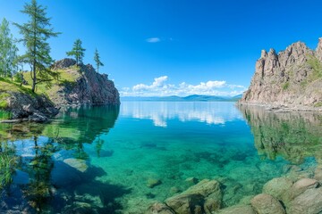 Breathtaking reflections of serene waters and rocky cliffs under a clear blue sky in a remote...