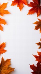 Autumnal frame of vibrant orange and red maple leaves arranged on a crisp white background. Perfect for fall-themed designs, cards, or invitations.